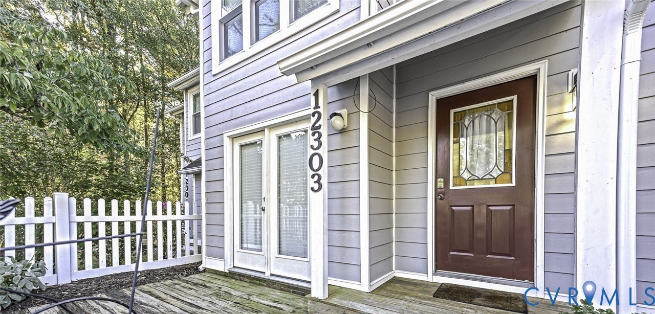 Covered exterior and a wooden deck with French door entry to kitchen. Great for entertaining.