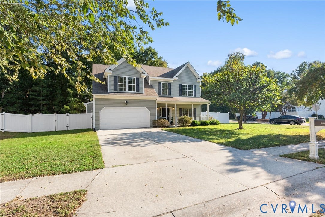 6852 Watch Harbour Circle, Hayes, VA 23072 Two-story residence with light gray siding and white trim