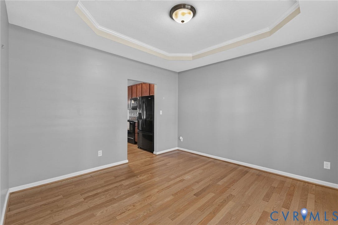 6852 Watch Harbour Circle, Hayes, VA 23072 Recessed ceiling with crown molding, wood-finish flooring, and a semi-flush mount light fixture