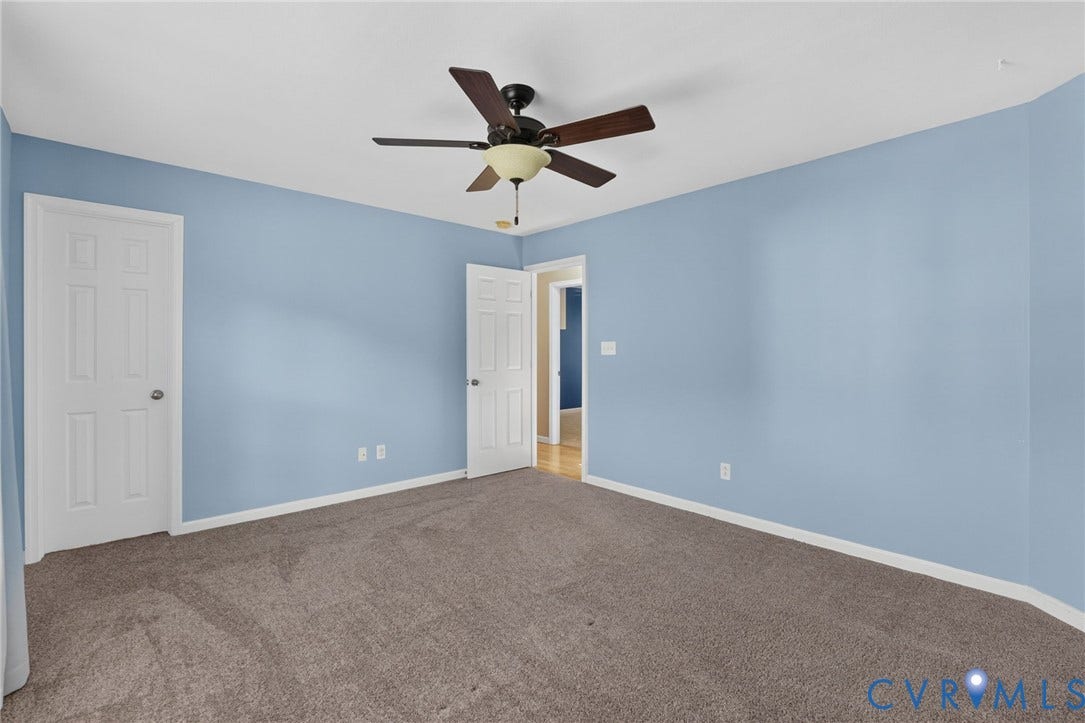 6852 Watch Harbour Circle, Hayes, VA 23072 Plush carpeting, light blue wall paint, and a ceiling fan with light fixture