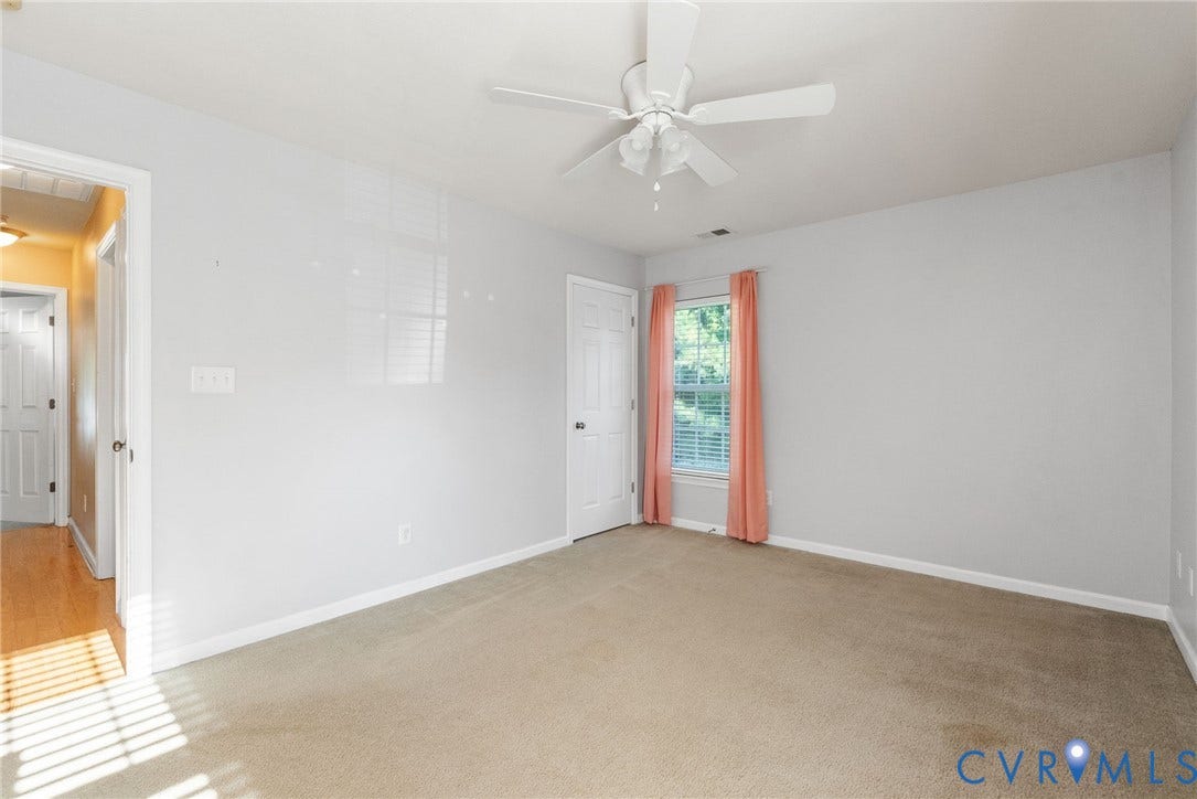 6852 Watch Harbour Circle, Hayes, VA 23072 Neutral wall paint, ceiling fan with light, window with blinds, carpeted flooring, and white trim