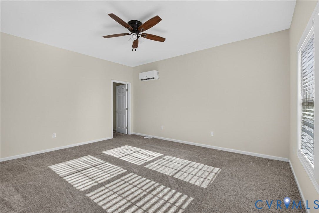 6852 Watch Harbour Circle, Hayes, VA 23072 Carpeted flooring, neutral wall tones, ceiling fan, window with blinds, and mini-split AC unit