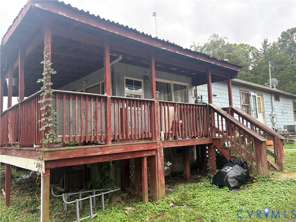Wood-finish deck with a covered porch and built-in steps