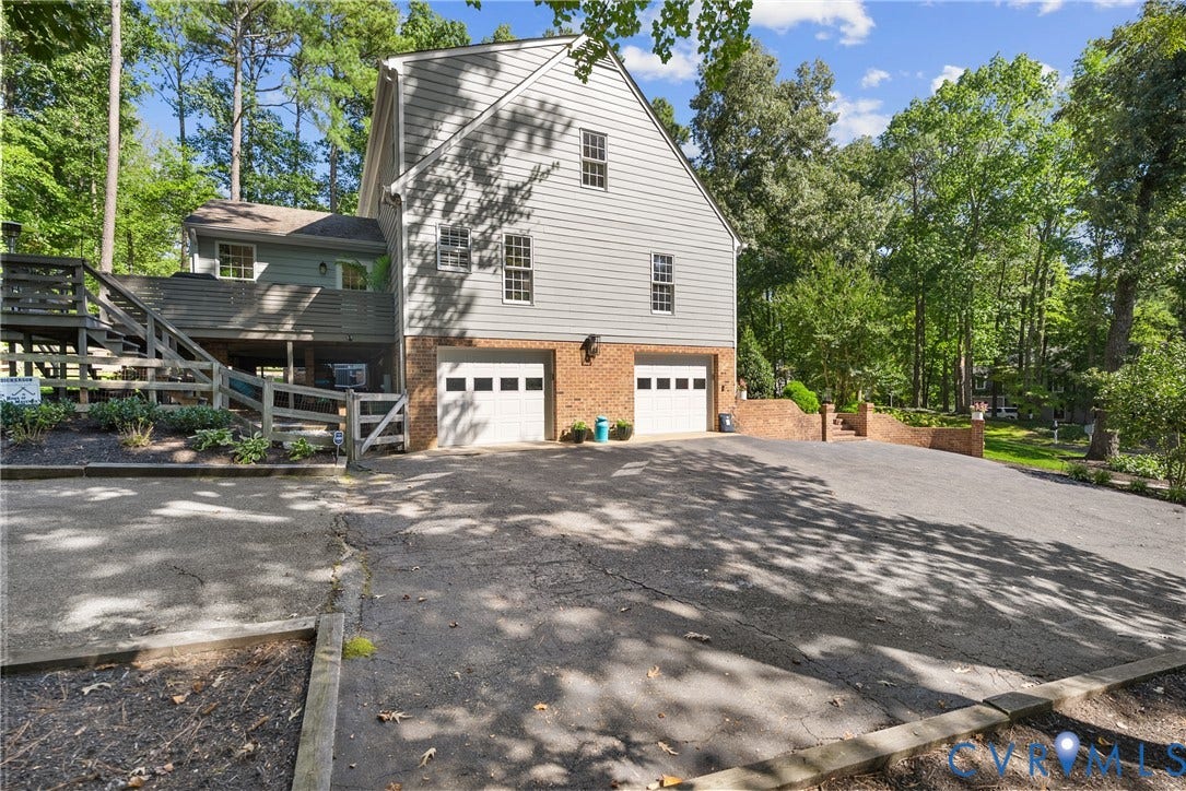 200 Ruggles Place, Tuckahoe, Henrico, VA 23229 Oversized garage will easily accommodate full length SUV's. Spacious driveway to park multiple vehicles