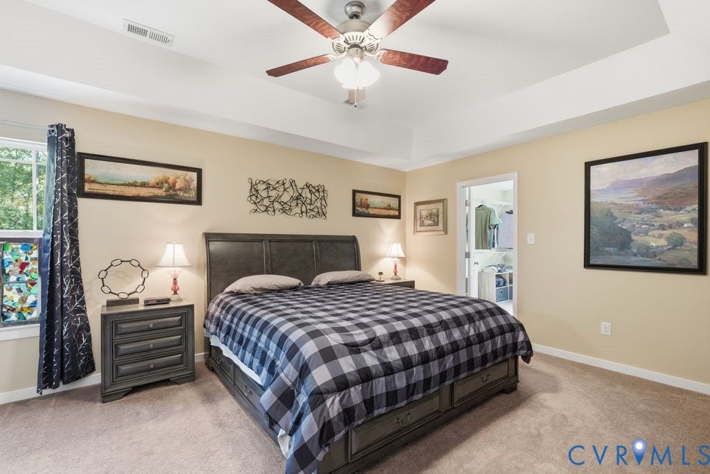 2490 Mountain Road, Glen Allen, VA 23060 Tray ceiling, central ceiling fan with integrated lighting, and carpeted flooring