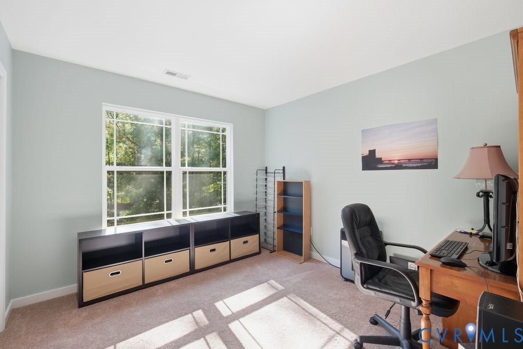 2490 Mountain Road, Glen Allen, VA 23060 Neutral-toned room featuring wall-to-wall carpeting and large windows with integrated grids