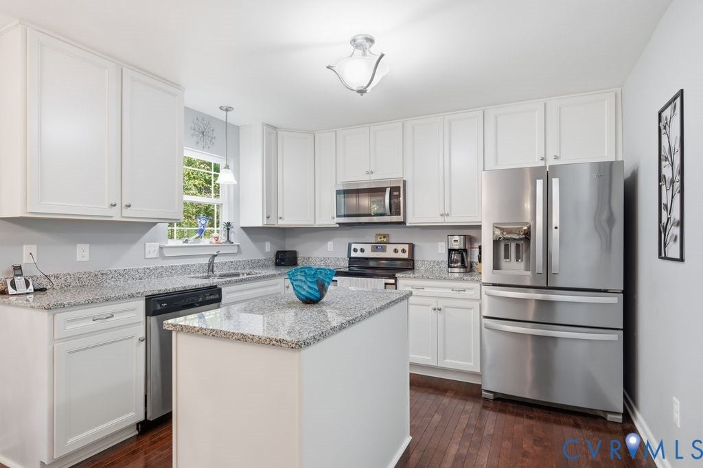 2490 Mountain Road, Glen Allen, VA 23060 Kitchen featuring white cabinetry, stone-finish countertops, stainless steel appliances, a central island, and wood-finish flooring