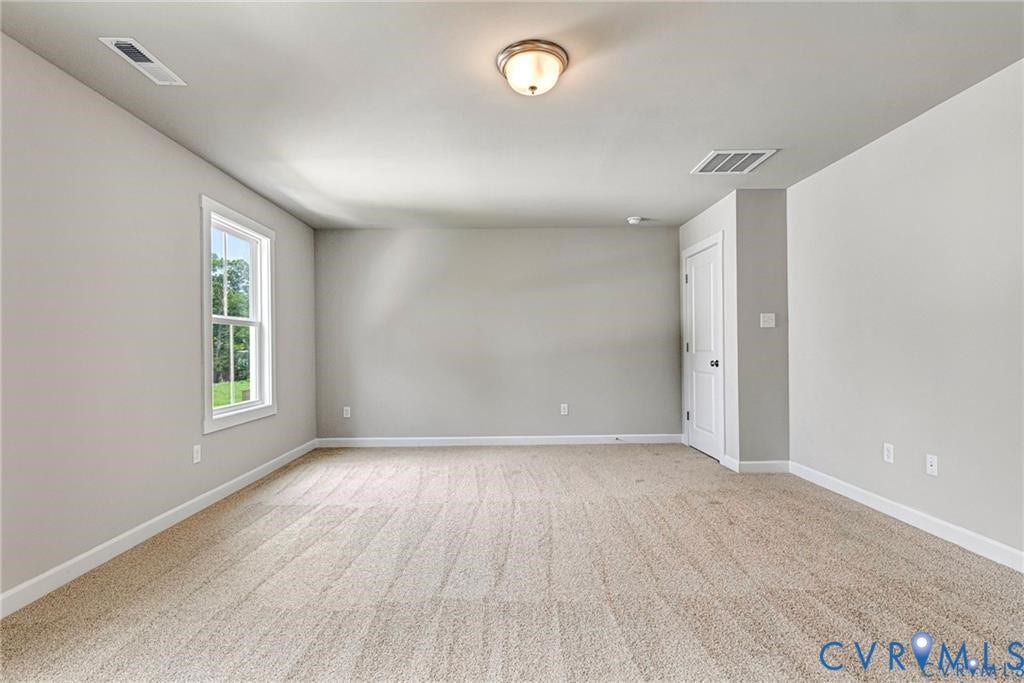 Recessed lighting, light-toned carpeting, single window, white trim, and a flush-mount ceiling light
