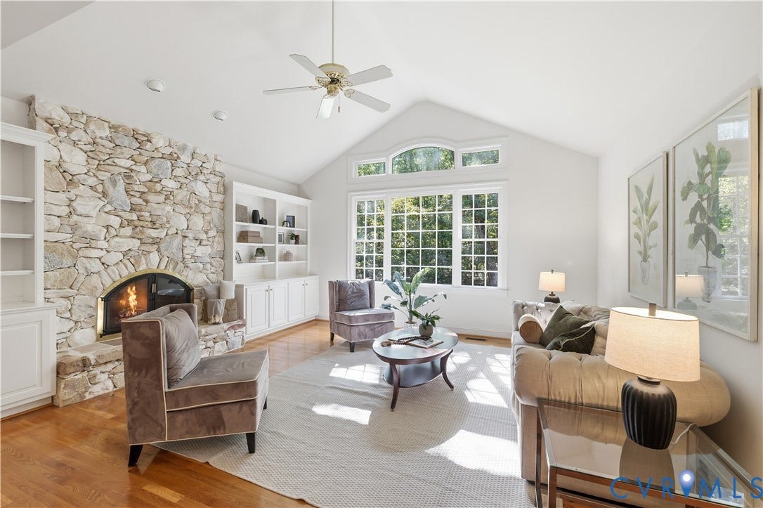 2611 Glenalmond Court, Powhatan, VA 23139 Vaulted family room features stone fireplace with flanking built-ins and hardwood floors.