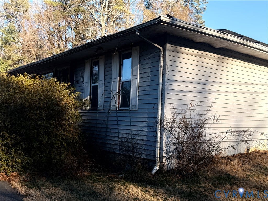 106 Hickory Drive, Goochland, VA 23103 Exterior facade featuring horizontal siding, shutters, and a low-pitch roofline