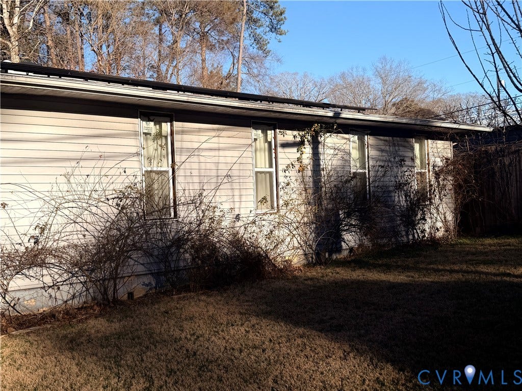 106 Hickory Drive, Goochland, VA 23103 Single-story exterior featuring light-toned horizontal siding, a pitched roofline, and four vertical windows