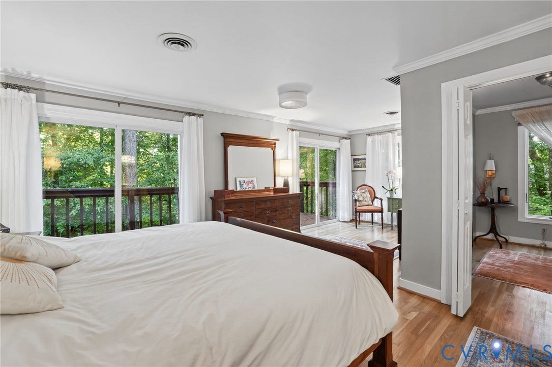 4815 Woodbriar Court, Midlothian, VA 23112 Hardwood flooring, crown molding, dual sliding glass doors providing outdoor access, and natural light exposure