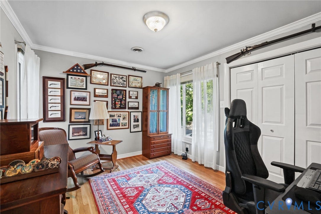 4815 Woodbriar Court, Midlothian, VA 23112 Room featuring wood-finish flooring, crown molding, double-panel closet doors, and multi-pane windows