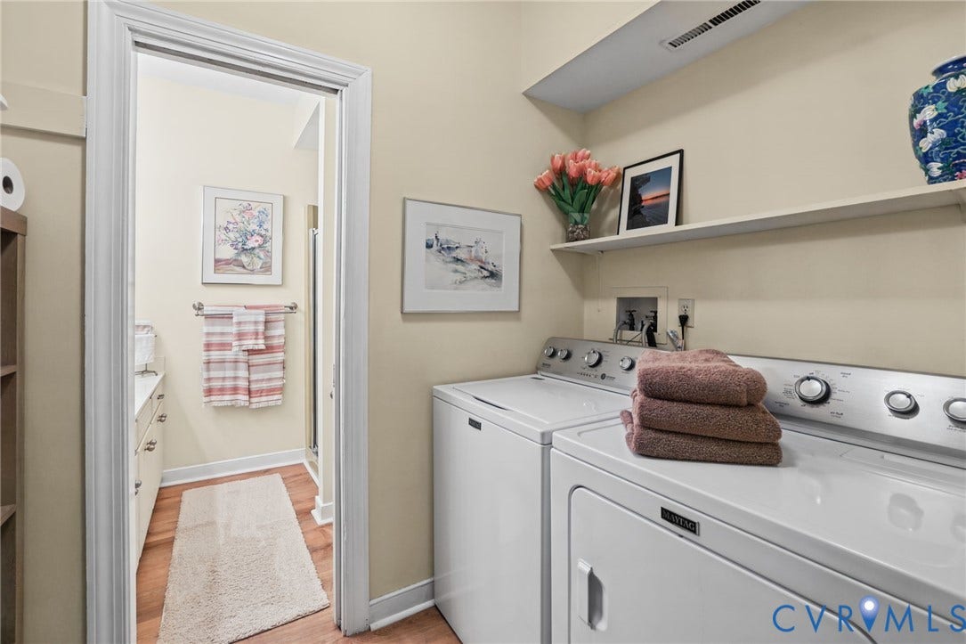 4815 Woodbriar Court, Midlothian, VA 23112 Laundry room featuring a built-in floating wall shelf and wood-finish flooring