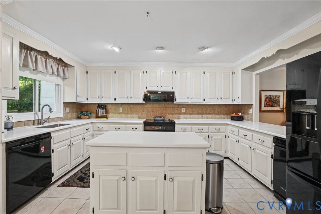 4815 Woodbriar Court, Midlothian, VA 23112 Kitchen featuring white raised-panel cabinetry, center island, solid-surface countertops, tile backsplash, and recessed lighting
