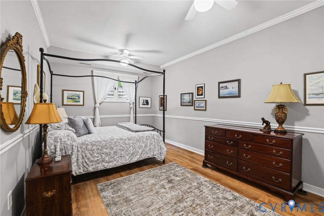 4815 Woodbriar Court, Midlothian, VA 23112 Wood-finish flooring, crown molding, chair rail molding, and a ceiling-mounted light fixture