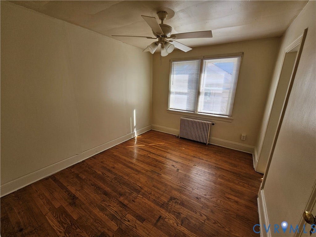 613 E Brookland Park Boulevard, #2, Richmond, VA 23222 Hardwood flooring, twin windows, ceiling fan, and baseboard heating unit