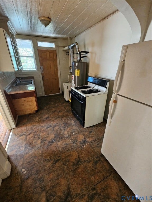 613 E Brookland Park Boulevard, #2, Richmond, VA 23222 Galley kitchen featuring stainless steel appliances, wood-finish cabinetry, and tile flooring