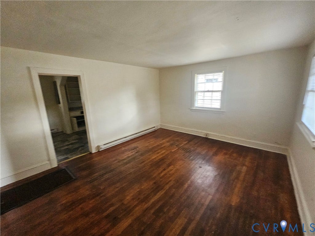 1410 E 18th Street, Richmond, VA 23224 Hardwood flooring, painted walls, window with blinds, and white trim