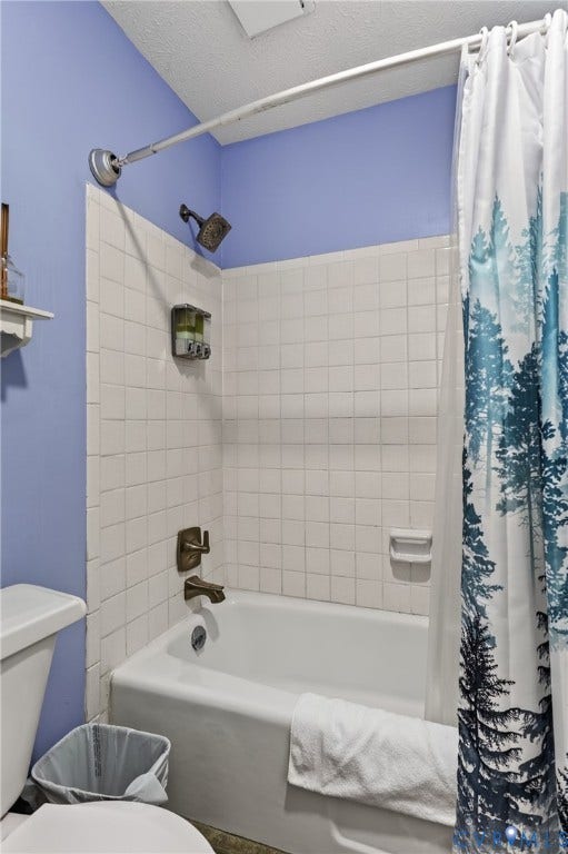 1836 FAIRWAY Drive, #218, Aspen East, Basye, VA 22810 White tile shower surround with a built-in tub, wall-mounted showerhead, and coordinating faucet
