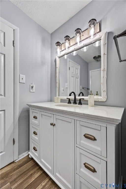 1836 FAIRWAY Drive, #218, Aspen East, Basye, VA 22810 White vanity with brass-finish hardware and integrated sink