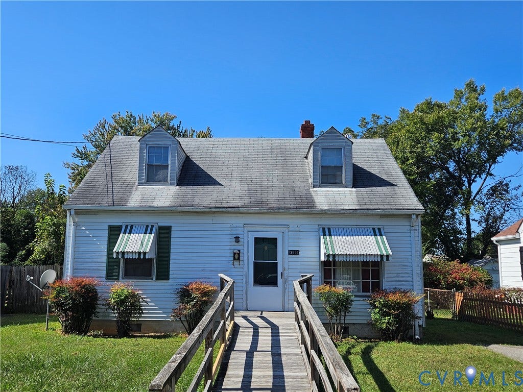 3814 Thimble Lane, Henrico, VA 23222 White siding exterior with a pitched roof, two dormer windows, and a front entry ramp