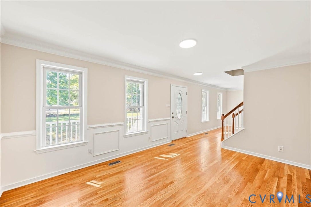 3216 Sherwood Bluff Terrace, Sherwood Bluff, Powhatan, VA 23139 Hardwood flooring, crown molding, chair rail wainscoting, recessed lighting, and a front entry door with an oval glass insert