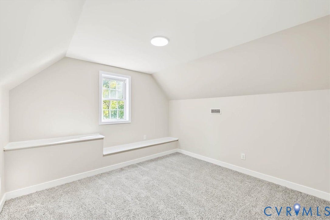 3216 Sherwood Bluff Terrace, Sherwood Bluff, Powhatan, VA 23139 Sloped ceiling architecture featuring neutral carpeting, a double-hung window, and a built-in ledge