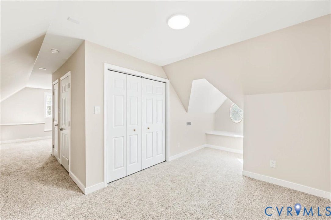 3216 Sherwood Bluff Terrace, Sherwood Bluff, Powhatan, VA 23139 Sloped ceilings with recessed architectural alcove, built-in window seat, oval accent window, neutral carpeting, and double-panel closet doors