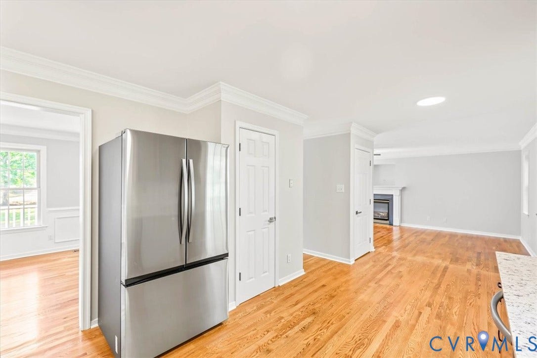 3216 Sherwood Bluff Terrace, Sherwood Bluff, Powhatan, VA 23139 Stainless steel French door refrigerator, wood-finish flooring, crown molding, and recessed lighting