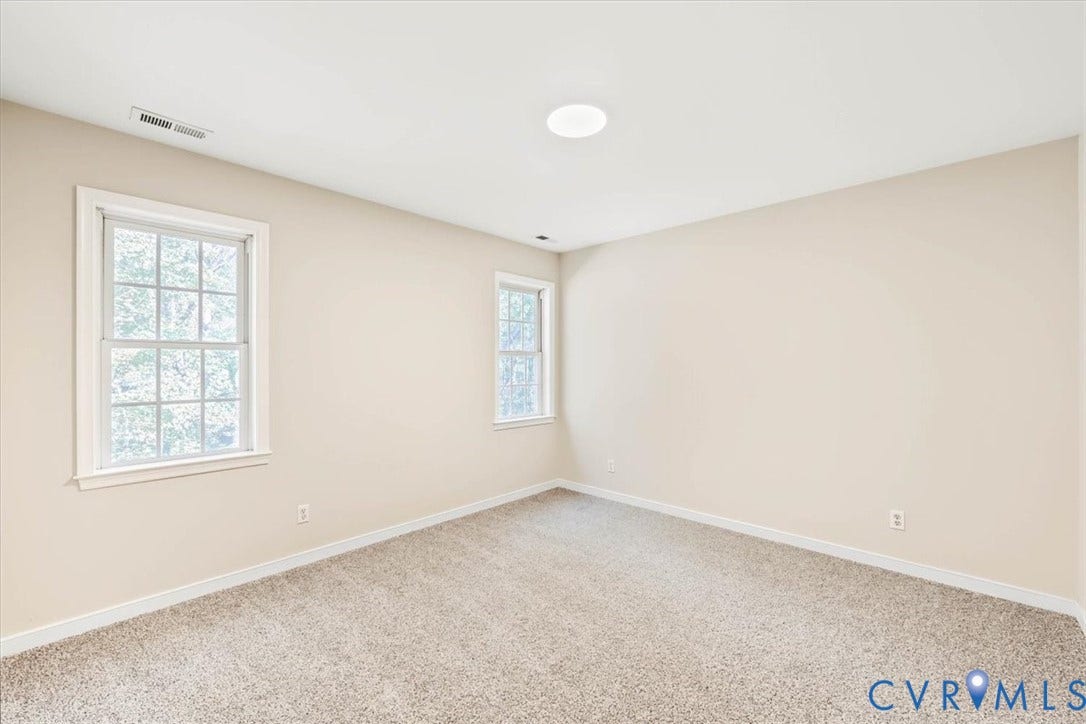 3216 Sherwood Bluff Terrace, Sherwood Bluff, Powhatan, VA 23139 Neutral-toned walls, wall-to-wall carpeting, and double-hung windows with white casing