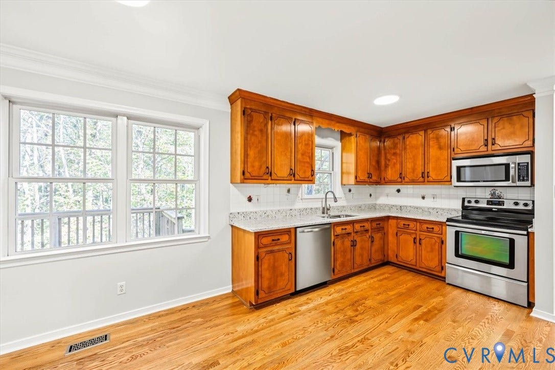 3216 Sherwood Bluff Terrace, Sherwood Bluff, Powhatan, VA 23139 Kitchen featuring wood cabinetry, stone-finish countertops, stainless steel appliances, and wood-finish flooring