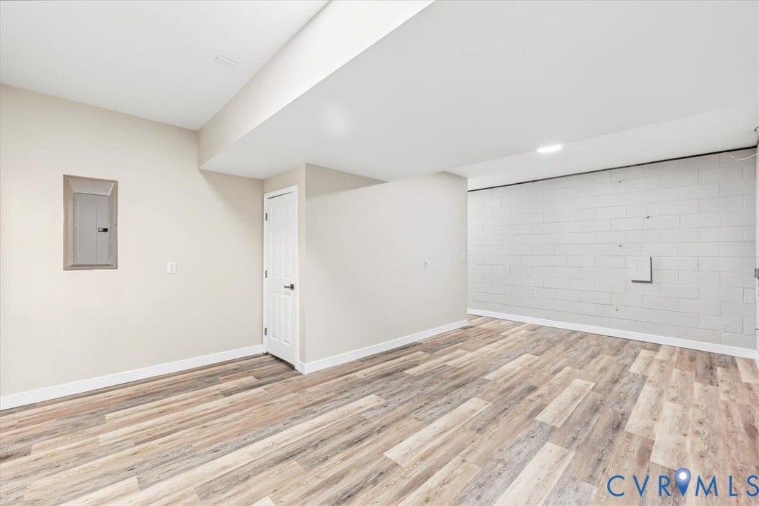 3216 Sherwood Bluff Terrace, Sherwood Bluff, Powhatan, VA 23139 Interior space featuring wood-finish flooring, recessed lighting, and a painted masonry accent wall
