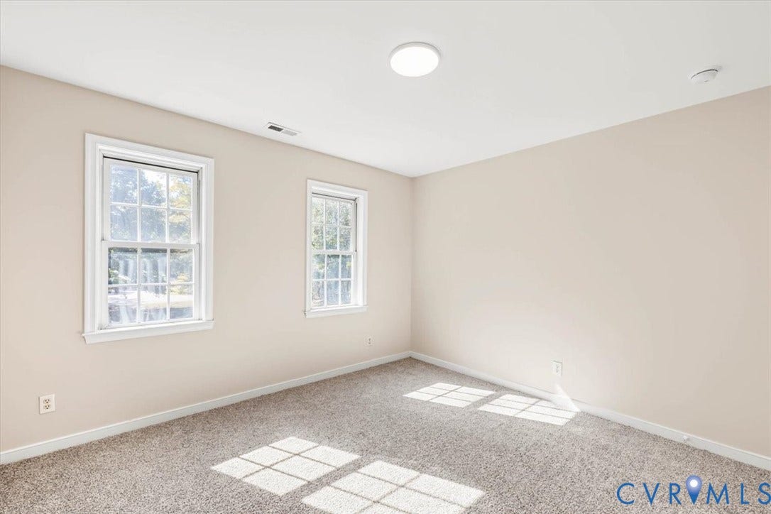 3216 Sherwood Bluff Terrace, Sherwood Bluff, Powhatan, VA 23139 Neutral interior space featuring wall-to-wall carpeting, two double-hung windows, and flush-mount ceiling lighting