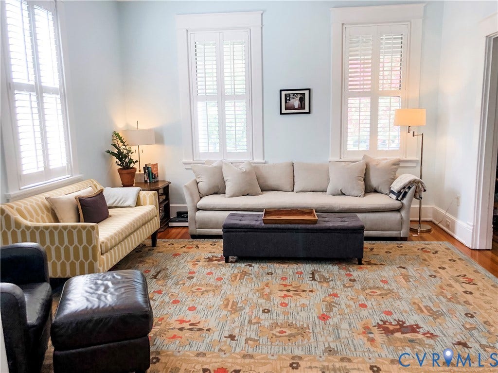 4216 Stonewall Avenue, Richmond, VA 23225 Hardwood flooring, multiple windows with plantation shutters, substantial crown molding, and an open doorway