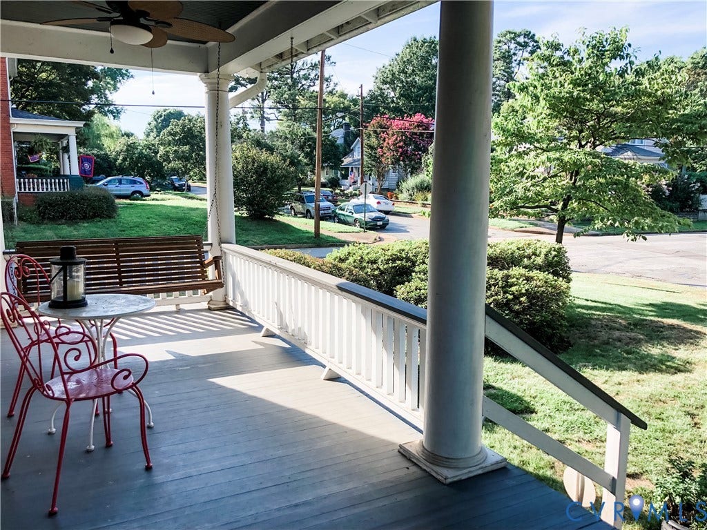 4216 Stonewall Avenue, Richmond, VA 23225 Expansive front porch featuring a dark wood-finish floor, white railing, and decorative columns