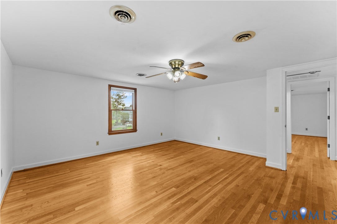 11612 Yorkdale Drive, Rivers Edge, North Prince George, VA 23860 Hardwood flooring, white painted walls, single window with wood trim, ceiling-mounted light fixture with fan, recessed ceiling air vents