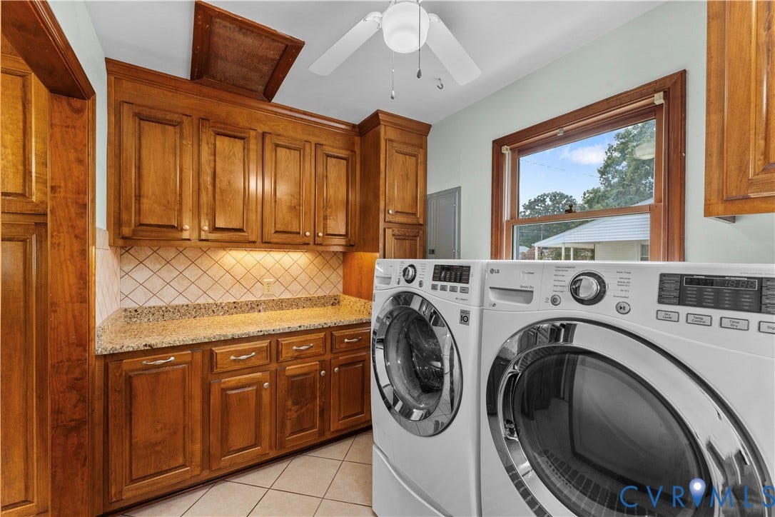 11612 Yorkdale Drive, Rivers Edge, North Prince George, VA 23860 Built-in wood cabinetry, granite-style countertop, diagonal tile backsplash, window with wood trim, and tile flooring