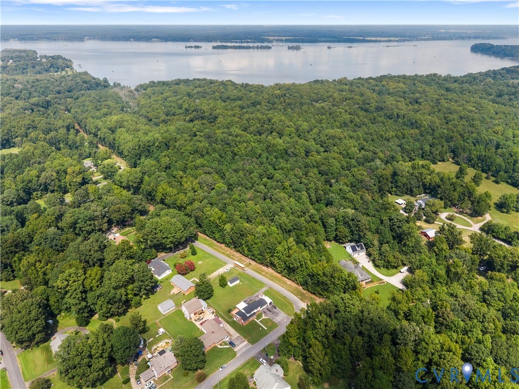 11612 Yorkdale Drive, Rivers Edge, North Prince George, VA 23860 Expansive tree-covered terrain offering a serene environment with a prominent water body in the background
