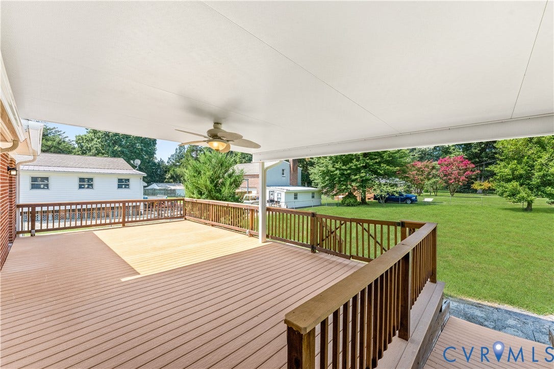 11612 Yorkdale Drive, Rivers Edge, North Prince George, VA 23860 Expansive covered deck with ceiling fan, featuring wood-finish decking and perimeter railing