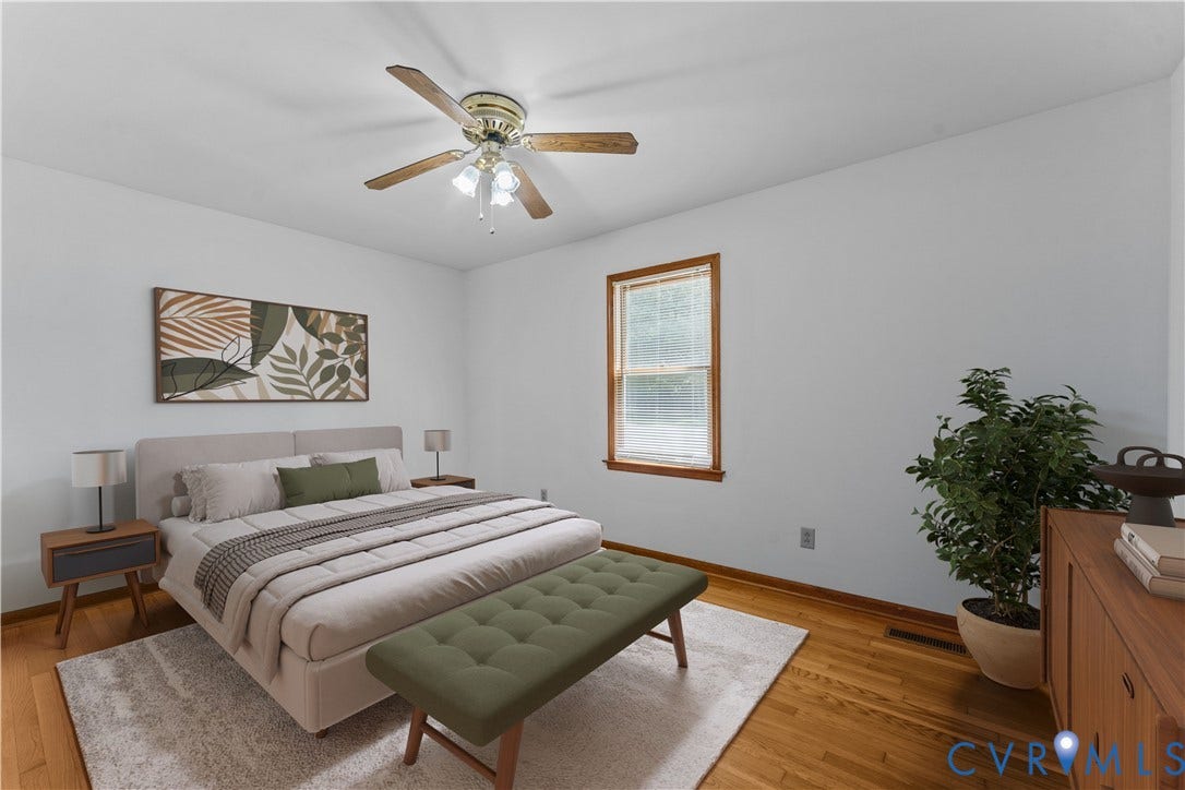 11612 Yorkdale Drive, Rivers Edge, North Prince George, VA 23860 Bright primary bedroom featuring hardwood flooring, a ceiling fan with integrated lighting, and large double-hung window