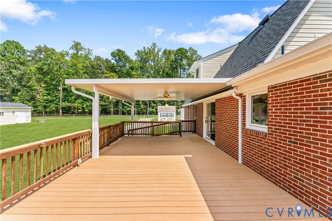 11612 Yorkdale Drive, Rivers Edge, North Prince George, VA 23860 Expansive wood-finish deck with a covered patio area and ceiling fan