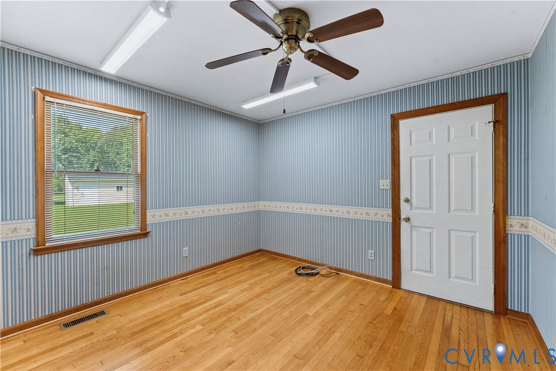 11612 Yorkdale Drive, Rivers Edge, North Prince George, VA 23860 Wood-finish flooring, wood-trimmed window, ceiling fan, and overhead lighting fixtures