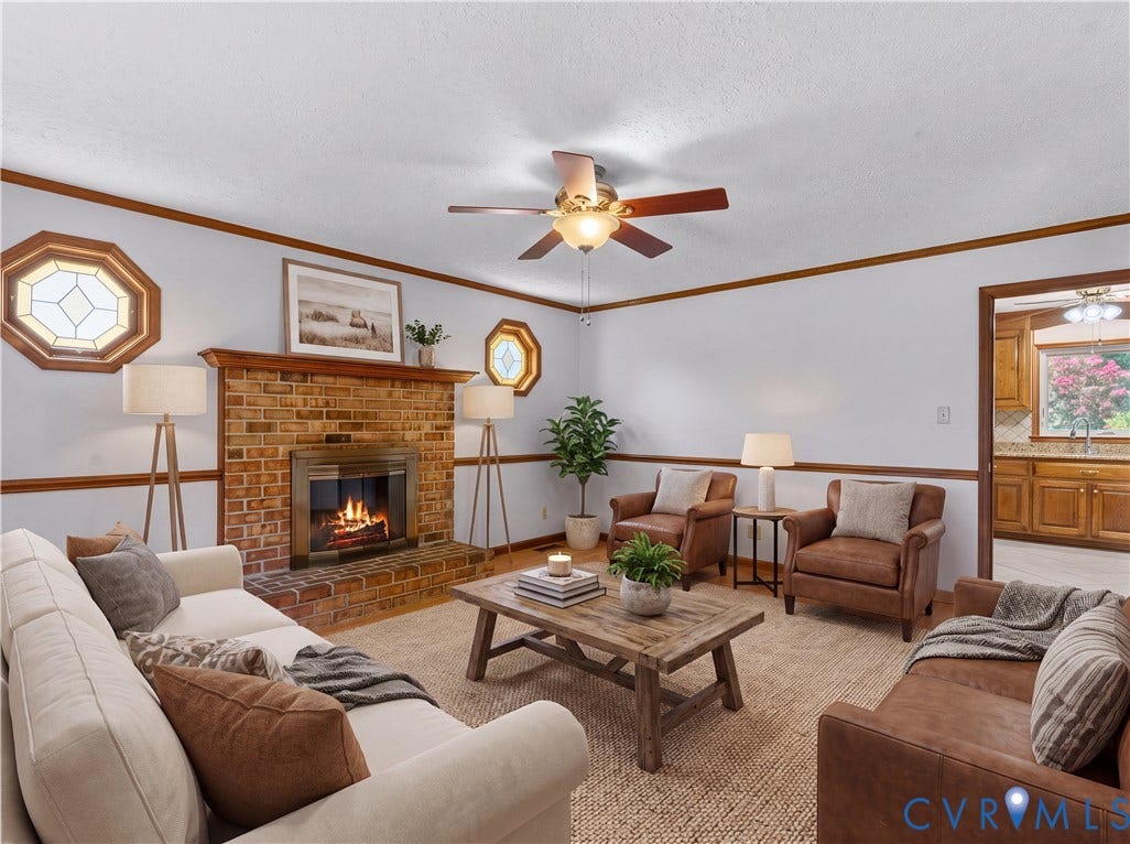 11612 Yorkdale Drive, Rivers Edge, North Prince George, VA 23860 Brick fireplace with wood mantel, hardwood trim detail, and two octagonal decorative windows