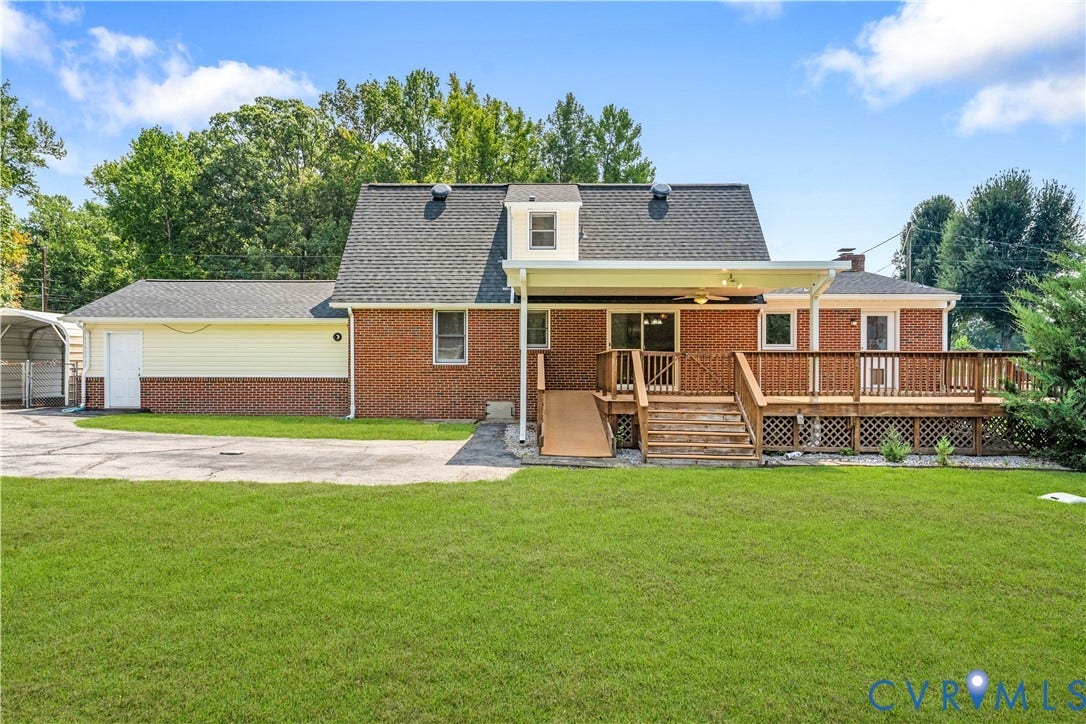 11612 Yorkdale Drive, Rivers Edge, North Prince George, VA 23860 Brick exterior with an expansive wooden deck, covered patio, and attached garage