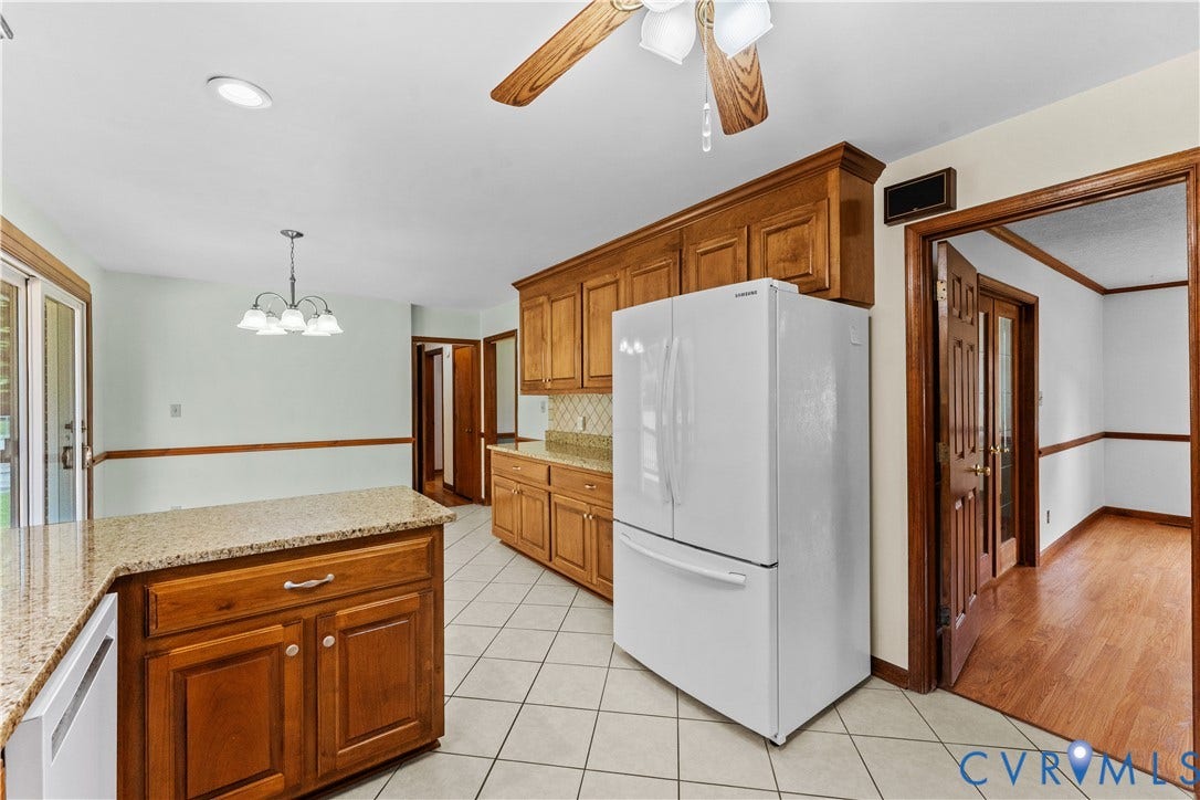 11612 Yorkdale Drive, Rivers Edge, North Prince George, VA 23860 Wood cabinetry, granite countertops, tile flooring, and a ceiling fan