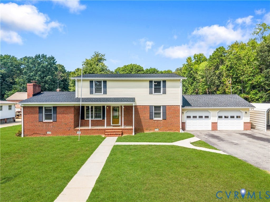 11612 Yorkdale Drive, Rivers Edge, North Prince George, VA 23860 Two-story residence featuring a brick and siding exterior, a covered front porch, and a two-car attached garage