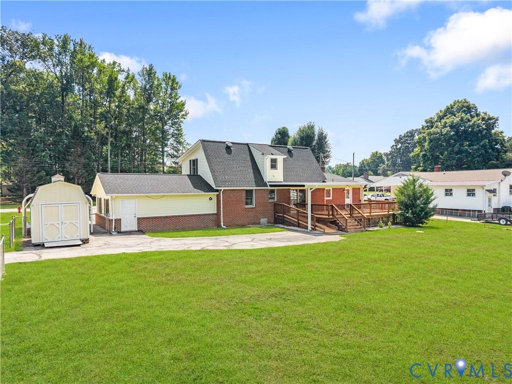11612 Yorkdale Drive, Rivers Edge, North Prince George, VA 23860 Expansive green lawn with a large wooden deck and ramp access