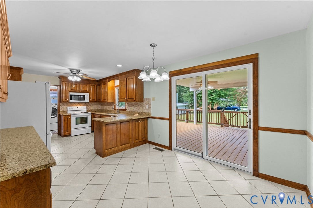 11612 Yorkdale Drive, Rivers Edge, North Prince George, VA 23860 Kitchen featuring wood cabinetry, light-toned countertops, white tile flooring, and a ceiling fan