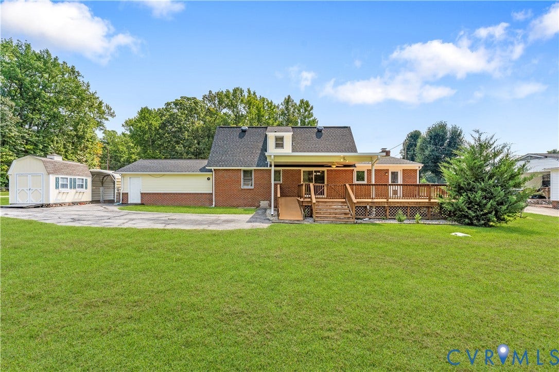 11612 Yorkdale Drive, Rivers Edge, North Prince George, VA 23860 Expansive green lawn, wood deck, covered patio, attached garage, and a detached storage shed